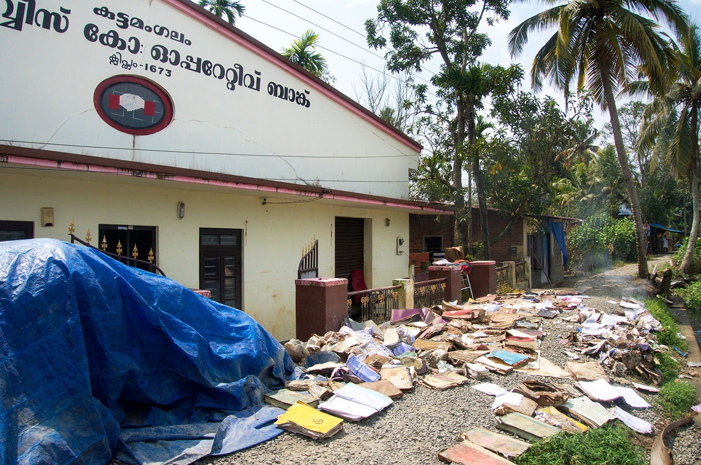 Documents laid out on the bank along the river to dry