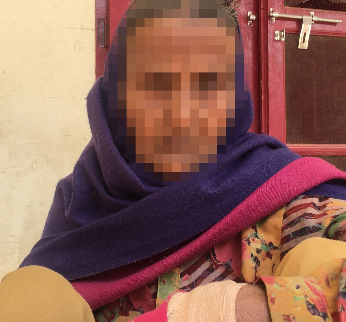 Aarifa: 'Using a contraceptive is considered a crime'; she had sprained her hand when we met. Right: The one-room house where she lives alone in Biwan