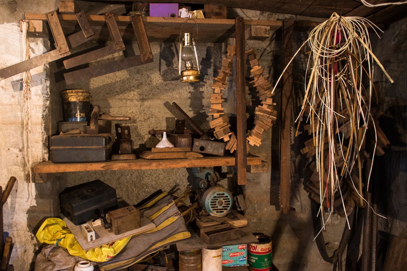 Bapu's workshop is replete with different tools of his trade, such as try squares (used to mark 90-degree angles on wood), wires, and motor rewinding instruments.