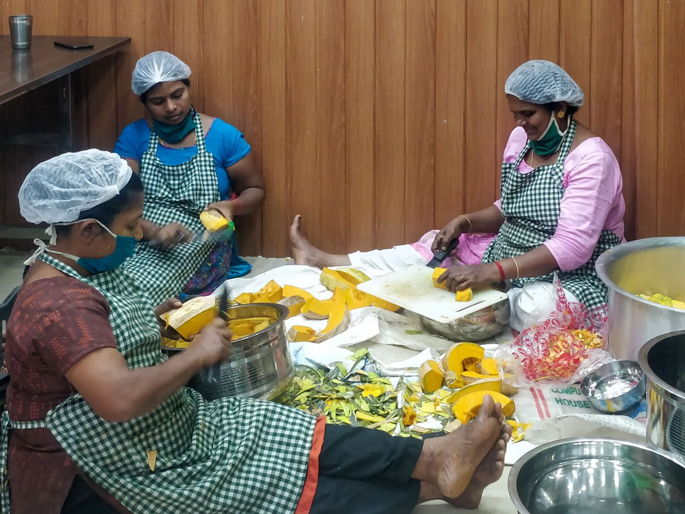 Kudumbashree members in the Janakeeya Hotel near Thiruvananthapuram's M.G. Road cook and pack about 500 takeaway meals every day