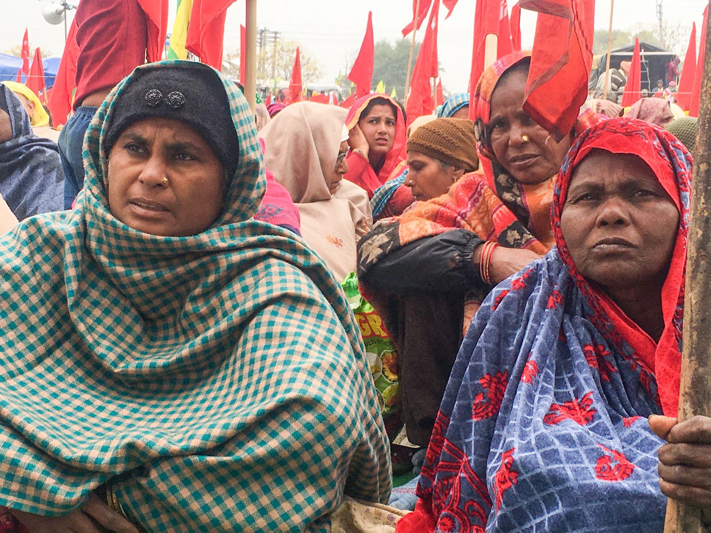 Hardeep Kaur (left), 42, is a Dalit labourer from Bhuttiwala village of Gidderbaha tehsil in Punjab’s Muktsar district. She reached the Tikri border on January 7 with other union members. “I started labouring in the fields when I was a child. Then the machines came and now I barely get work on farms," she says "I have a job card [for MGNREGA], but get that work only for 10-15 days, and our payments are delayed for months." Shanti Devi (sitting, right) a 50-year-old Dalit agricultural labourer from Lakhewali village of Muktsar district, says, “We can eat only when we have work. Where will go once these farm laws are implemented? Right: Shanti Devi’s hands