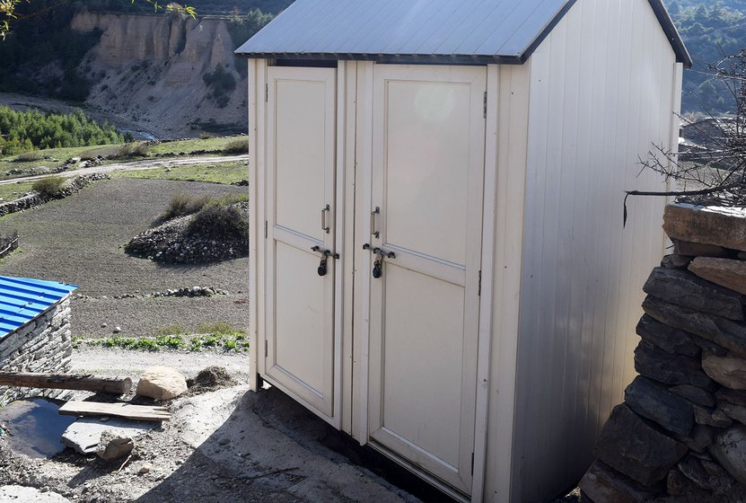 More make-shift toilets at the entrance of the village Gunji