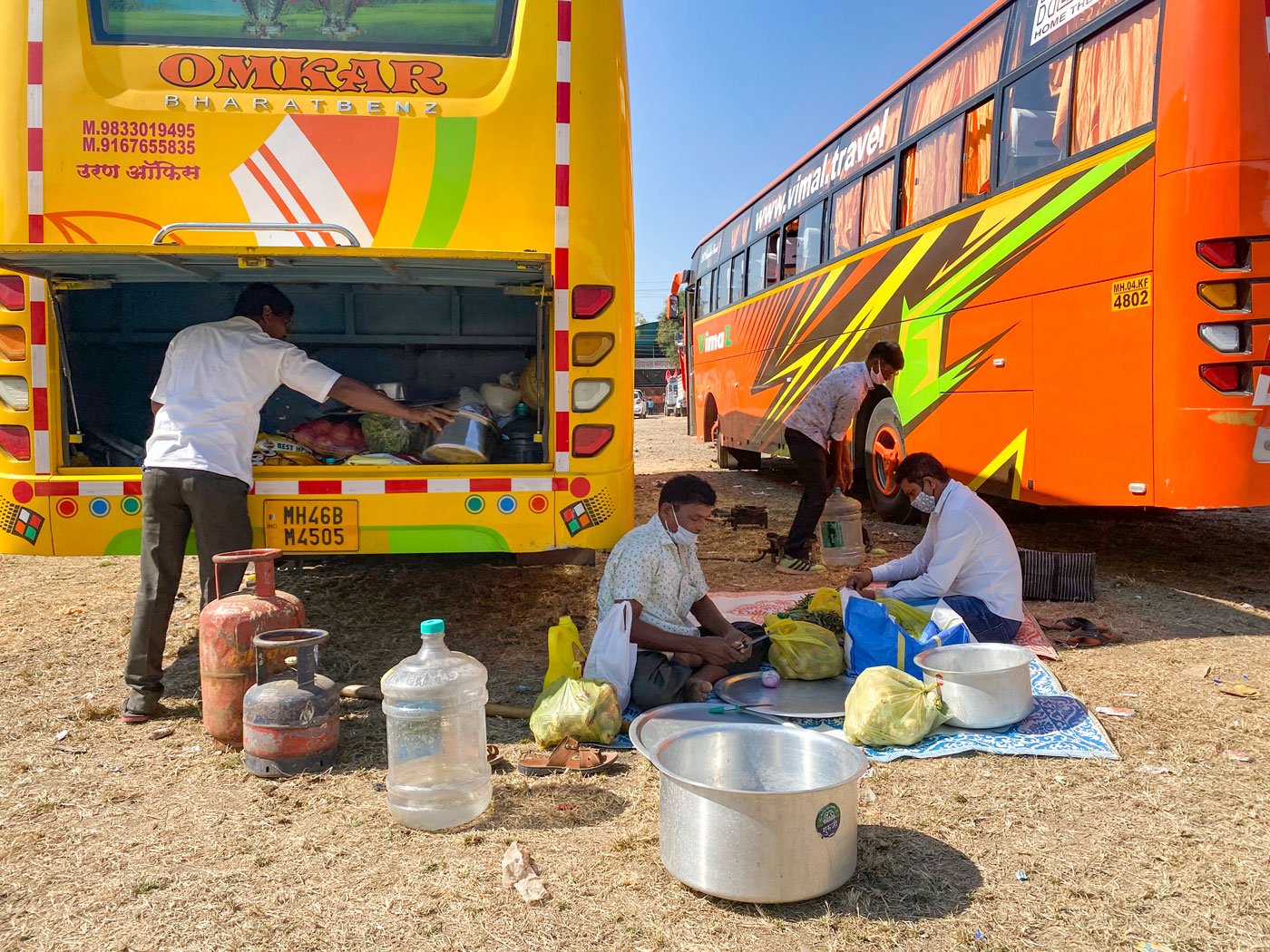 The bus is stacked with onions, potatoes and rice, among other items. When activists leading the march stop, Bhagat and his colleagues get to work