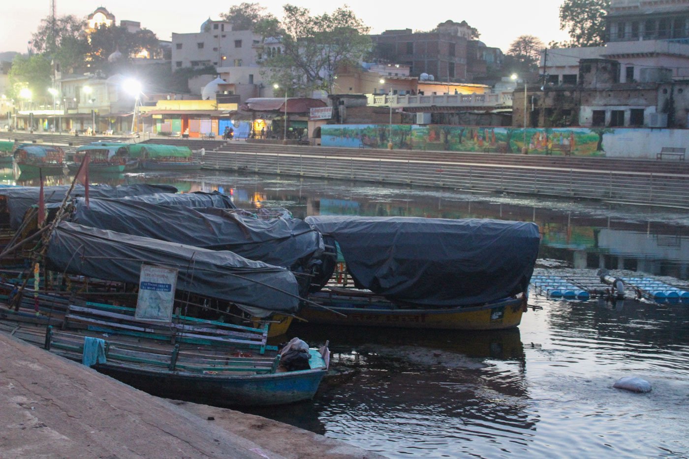 Left: Ramghat on the Mandakini river, before the lockdown. Right: Boats await their riders now