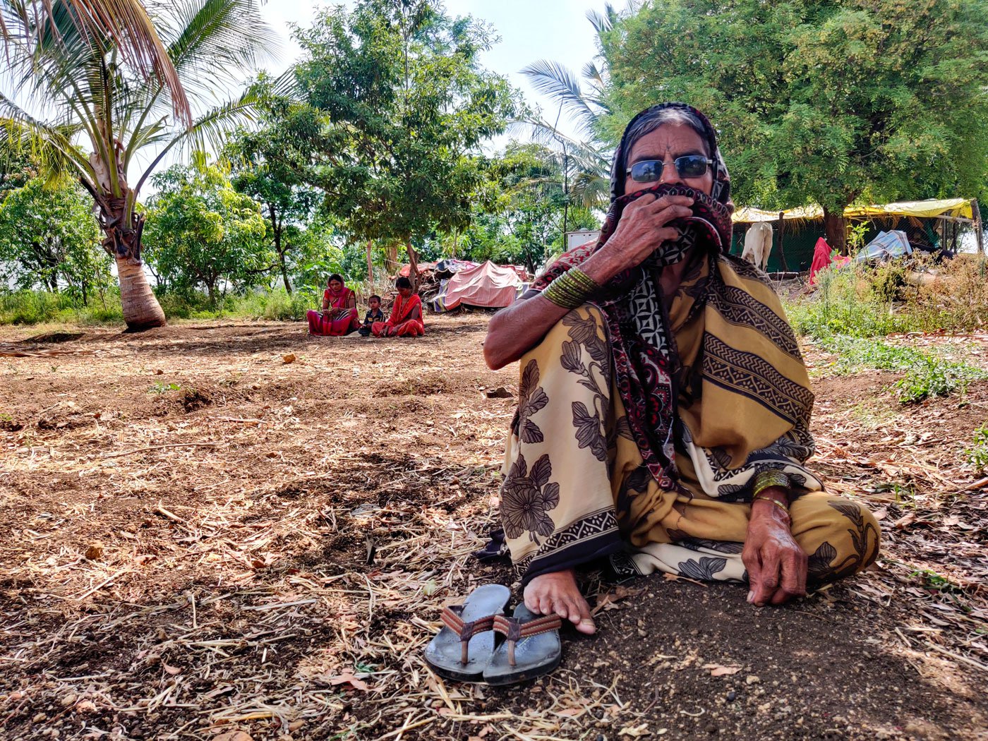 Sunita Magar and her home in Pandharyachiwadi village. She borrowed money to buy remdesivir vials from the black market for her husband's treatment
