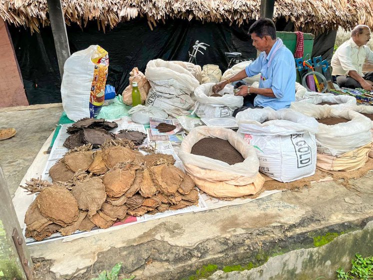 Right: A vendor sells tobacco leaves and tea powder