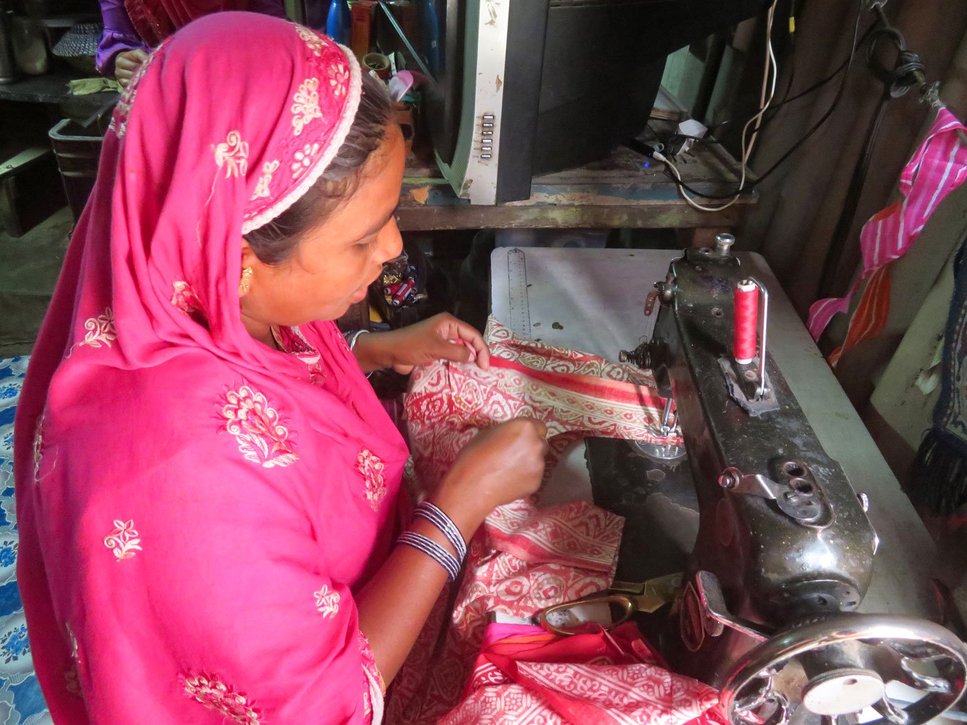 'We have one simple mobile. So we borrowed khala’s mobile', says Mubarak, here with his mother Momina (who stitches gowns and makes hairclips for an income) and sister Afsana