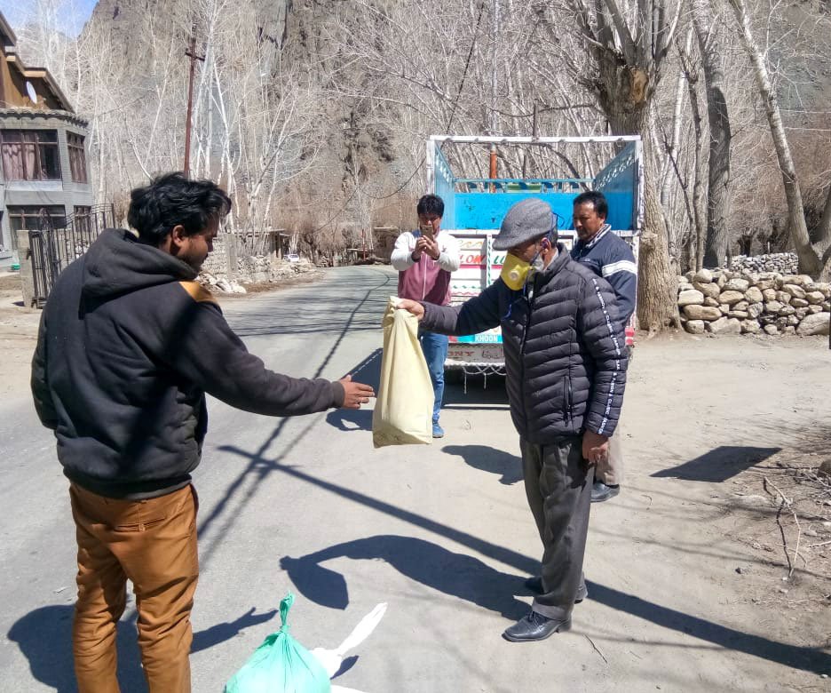 Left: An Iranian medical team examining Ladakhi pilgrims outside their hotel in Qom. Right: Rations being distributed in Kargil's Sankoo village