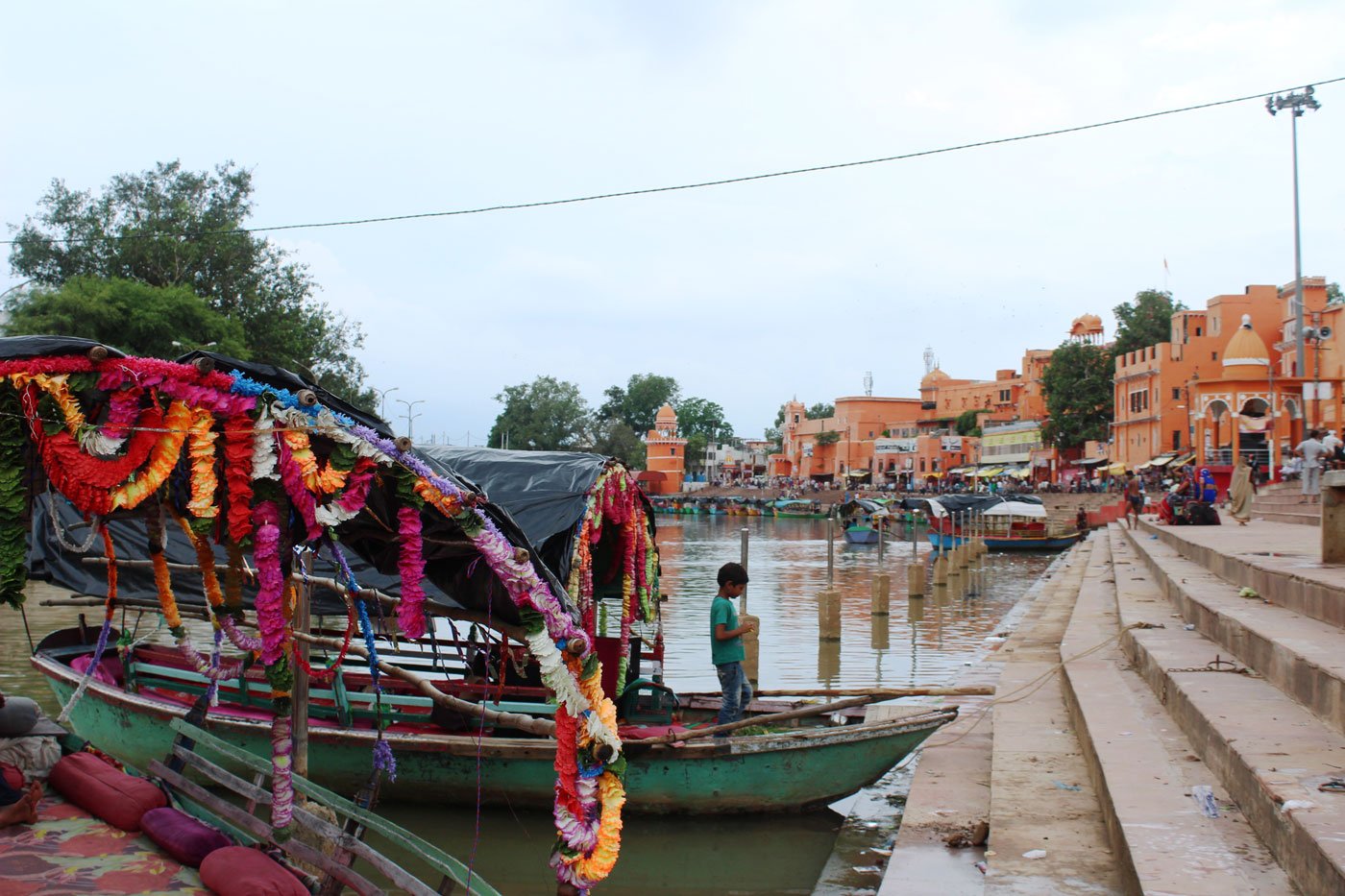 Left: Ramghat on the Mandakini river, before the lockdown. Right: Boats await their riders now