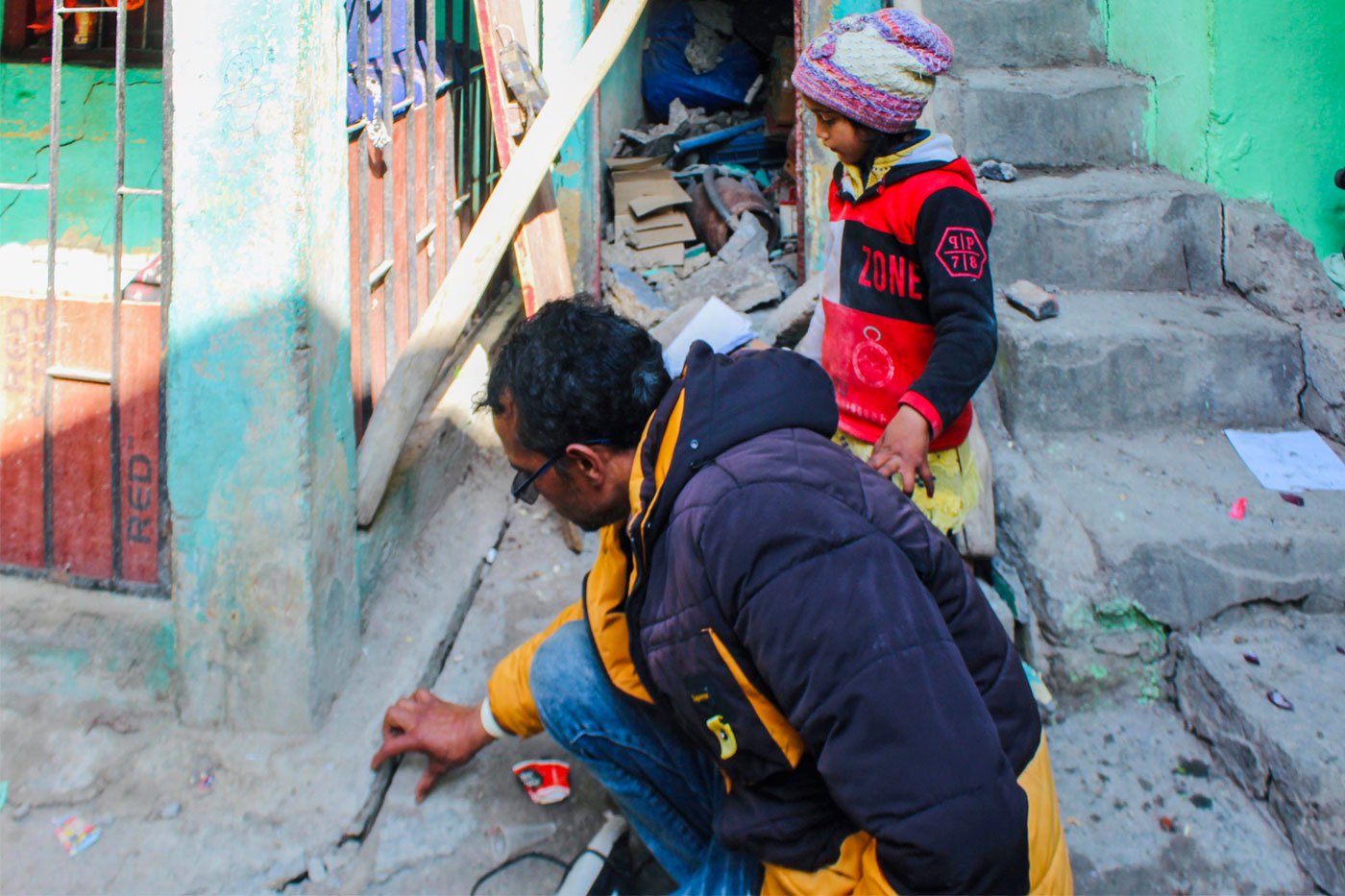 Raghav and Ayesha are examining cracks on the ground in their neighbourhood. He says, ‘My story is the story of all Joshimath.’