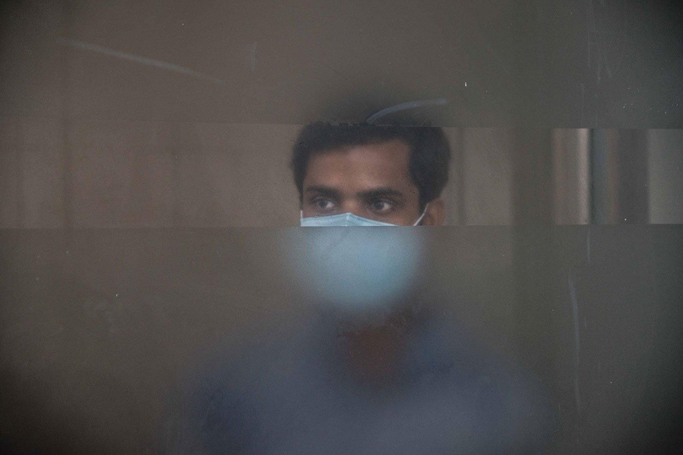 Left: A nurse in the Neonatal Intensive Care Unit (NICU). Despite seeing staff on duty falling to 40 per cent of normal, the hospital soldiers on in providing services for children-left. Right: Health worker hazards: Jayram Sen (name changed) of the ICH was not allowed, for several days, to take water from a community tap in his village in the South 24 Parganas