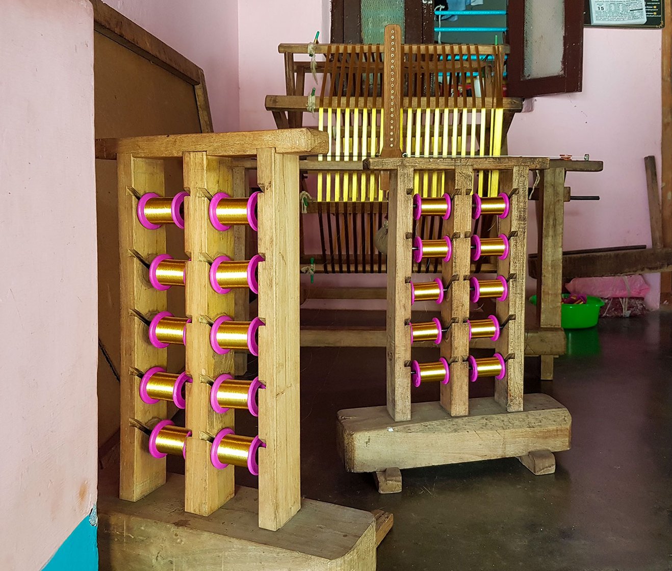 The charkha in Mani's house used to spin the kasavu into smaller rolls