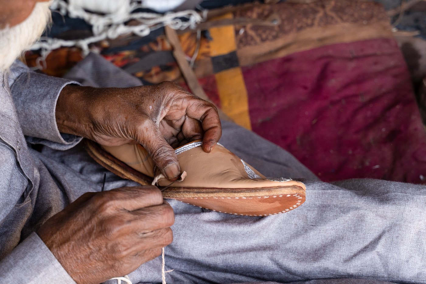 'I always start by stitching the upper portion of the jutti from the tip of the sole. The person who manages to do this right is a craftsman, others are not', he says.