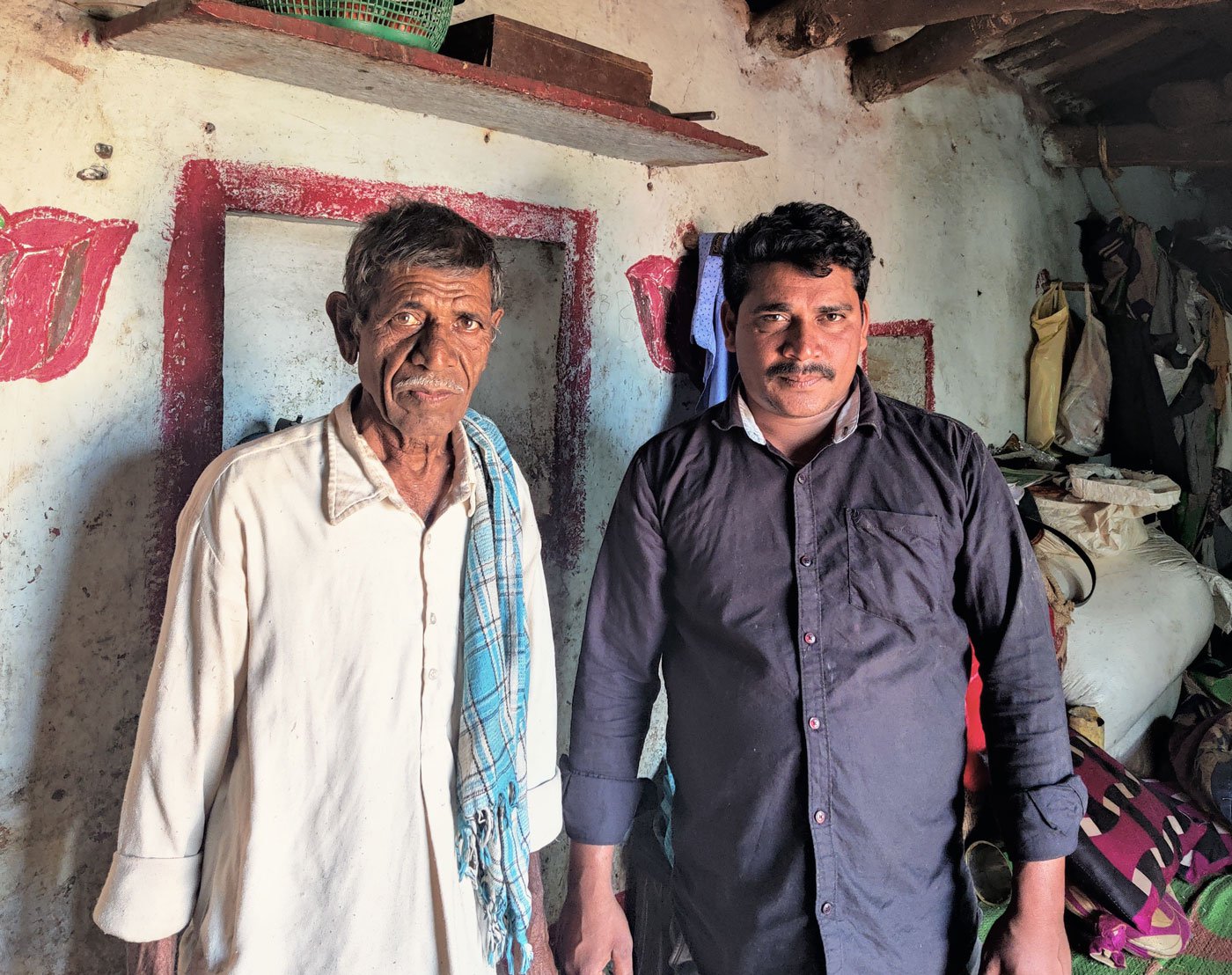 Badya bought two acres in Girgetpalle but his name was spelt incorrectly, he has not received the Rythu Bandhu money. Badya with his youngest son Govardhan (black shirt) in their one-room house