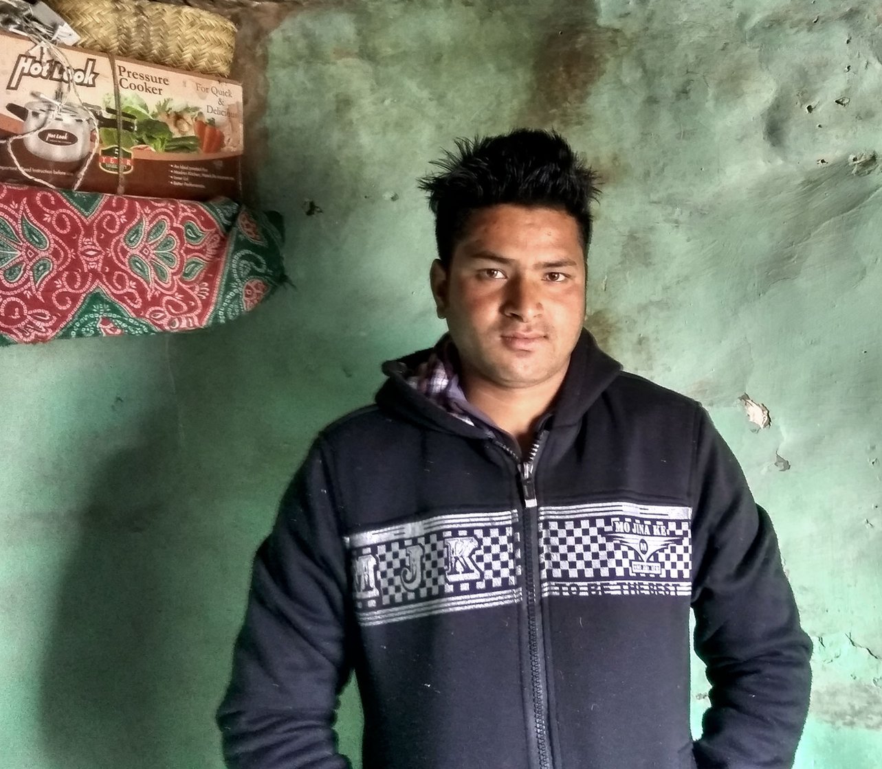 A man standing inside a house