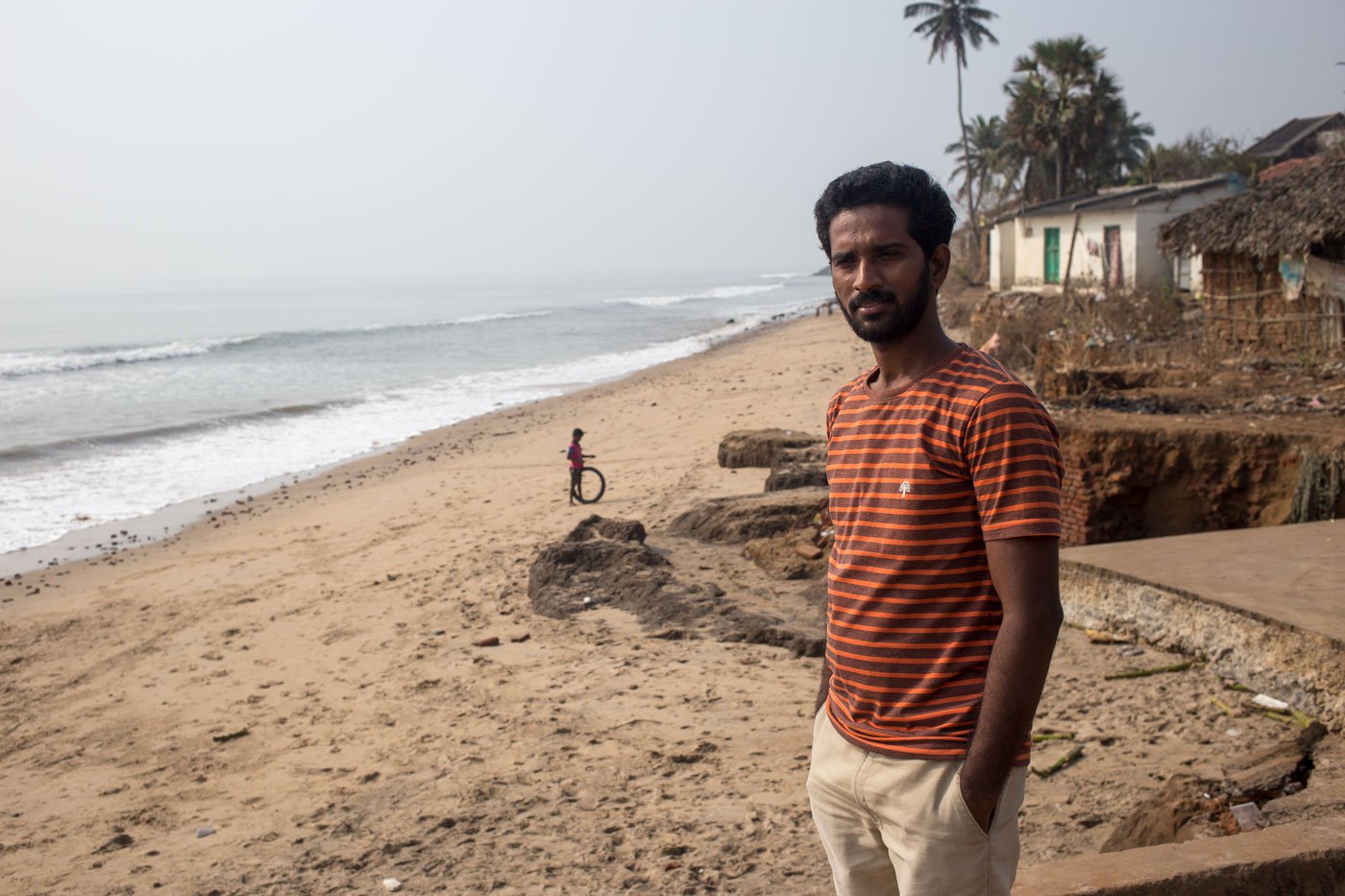 D. Prasad grew up in the coastal village, where he remembers collecting shells on the beach to sell for pocket money. With the sand and beach disappearing, the shells and buyers also vanished, he says