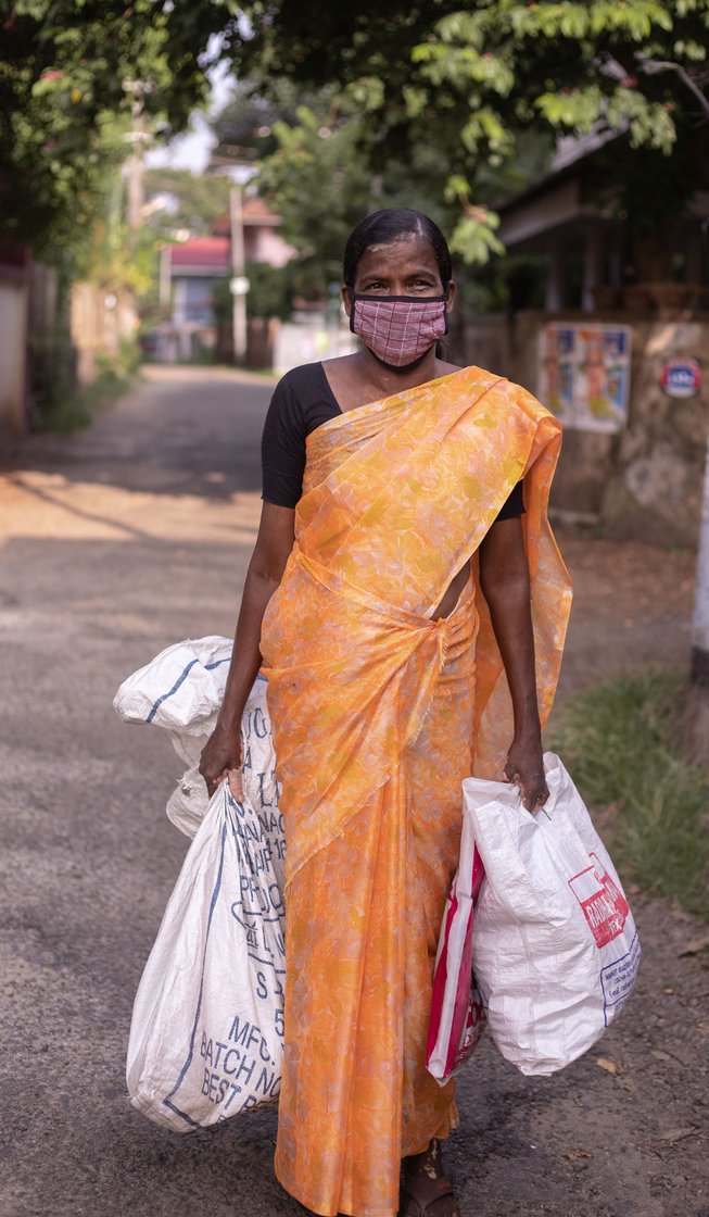 Left: After collecting the coconuts, Thankamma packs her working clothes and quickly changes into a saree to make it for the bus on time.