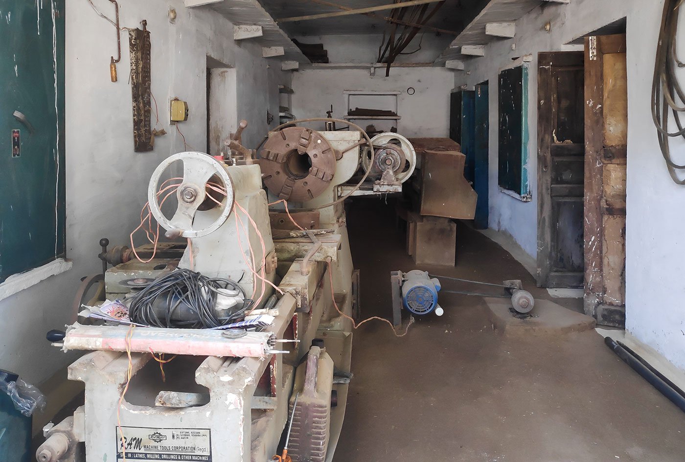 Mangal Singh’s factory where scraps of metal and machines used to build the turbine’s parts lie unused