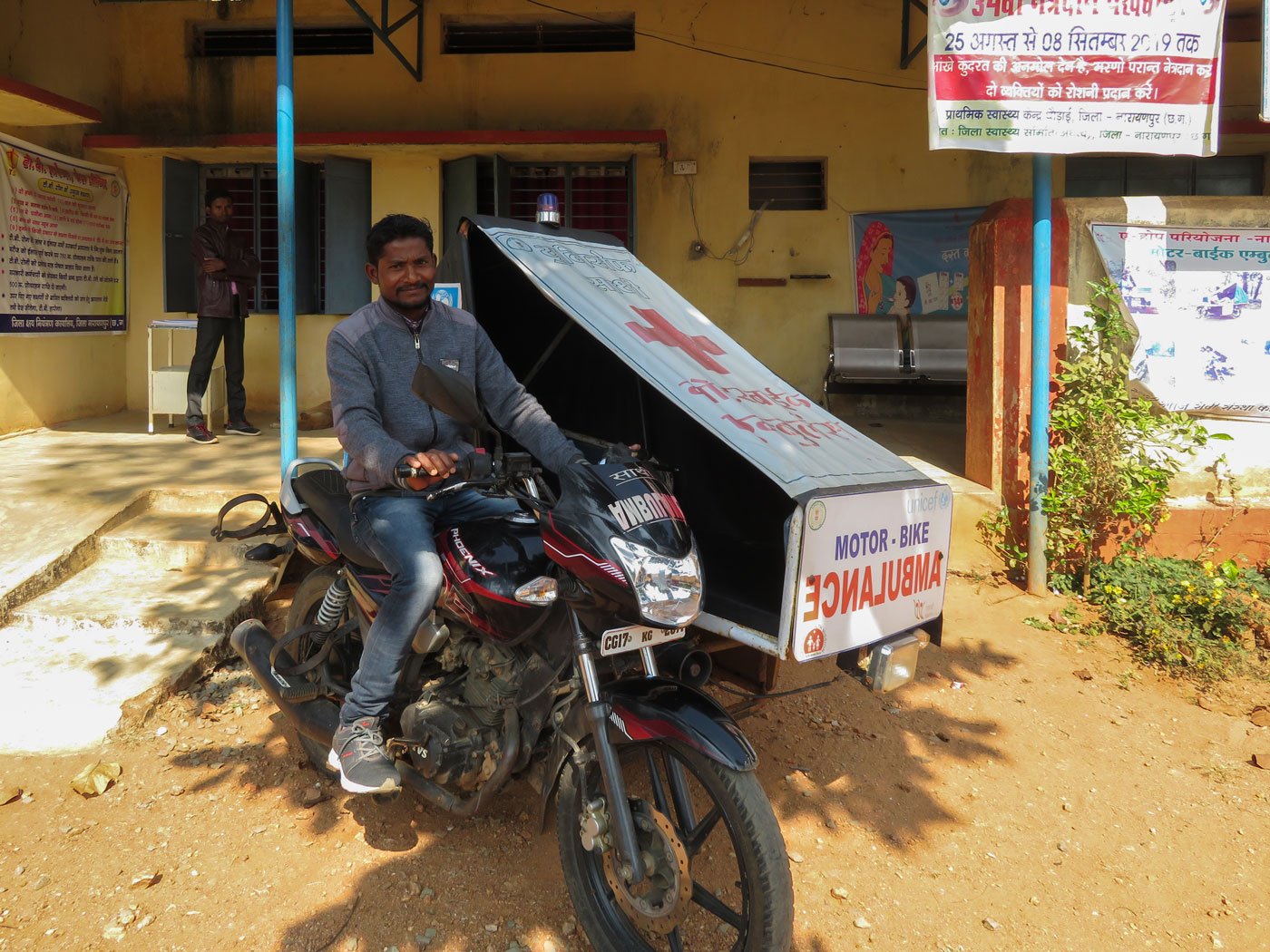 Left: 'The Dhodai PHC covers 47 villages, of which 25 have no approach road', says L. K. Harjpal (standing in the centre), the RMA at Dhodai. Right: To enable more women to approach public health services, the stage government introduced bike ambulances in 2014