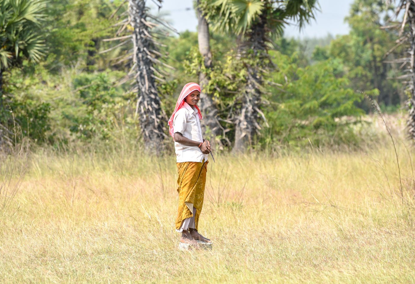 The Irula families of Bangalamedu depend on hunting for their meals. Left: M. Radha waits to trap a rabbit. Right: G. Subramani, catapult in hand, looks for birds
