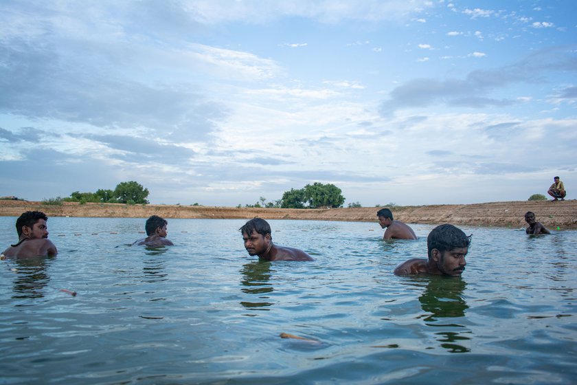 Right: They have to dive into the lake to drag out their nets