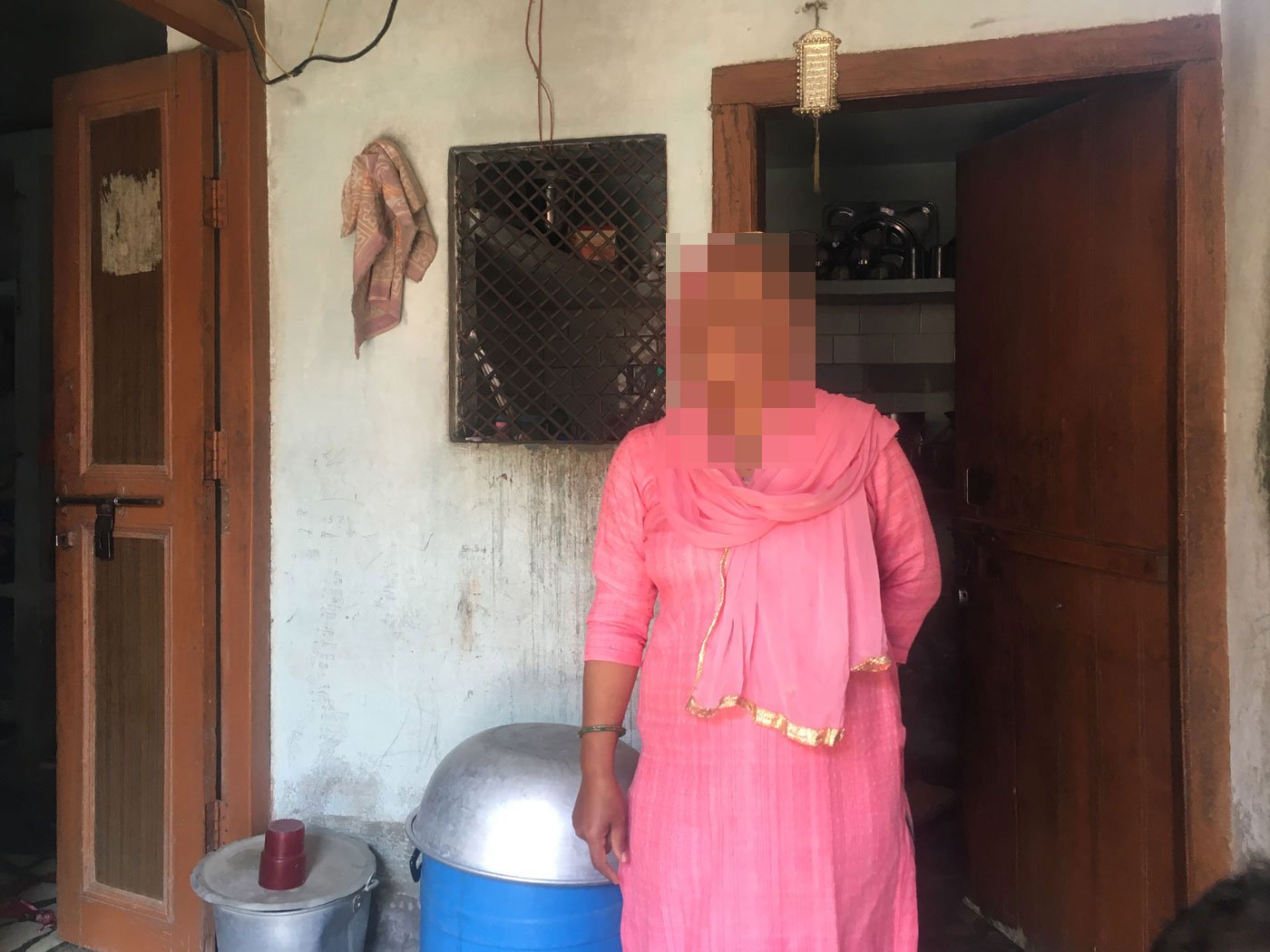 Sana Khan washing dishes in her home; she wanted to be a teacher after her degree in Education. 'Women have no option but to make adjustments', she says