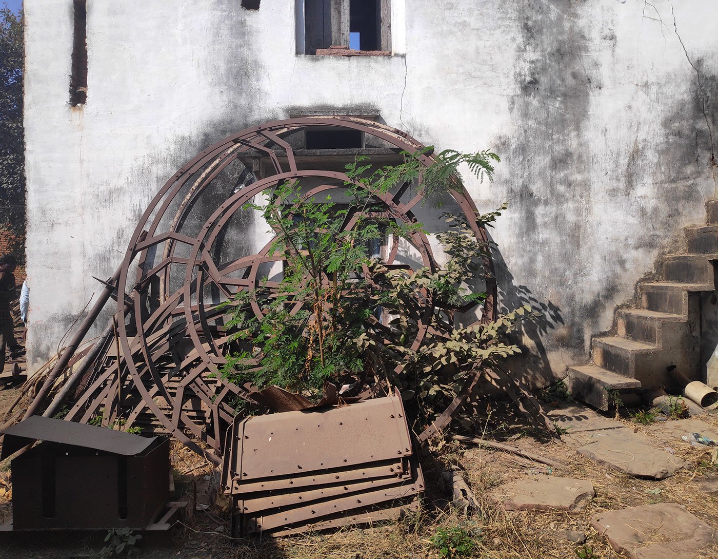 Mangal Singh’s factory where scraps of metal and machines used to build the turbine’s parts lie unused