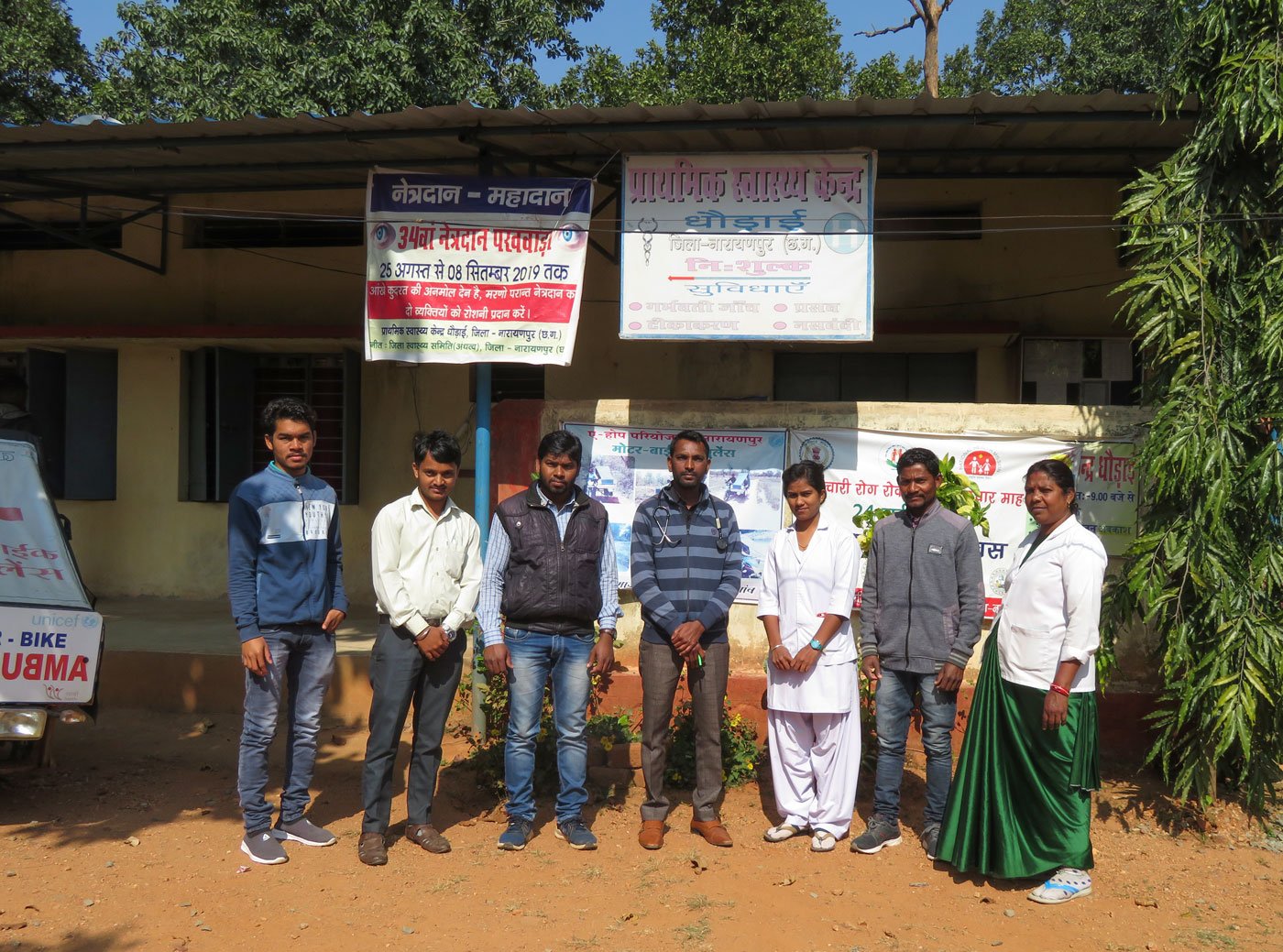 Left: 'The Dhodai PHC covers 47 villages, of which 25 have no approach road', says L. K. Harjpal (standing in the centre), the RMA at Dhodai. Right: To enable more women to approach public health services, the stage government introduced bike ambulances in 2014