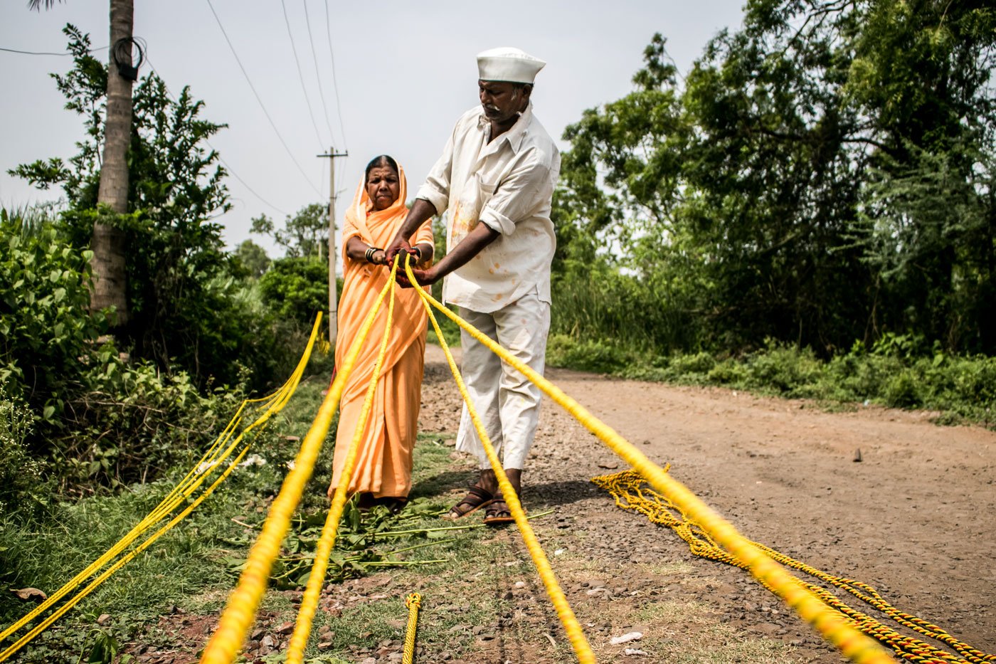 The Bhore family – Devu (wearing cap), Nandubai and Amit – craft ropes for farmers. There’s been no work now for weeks