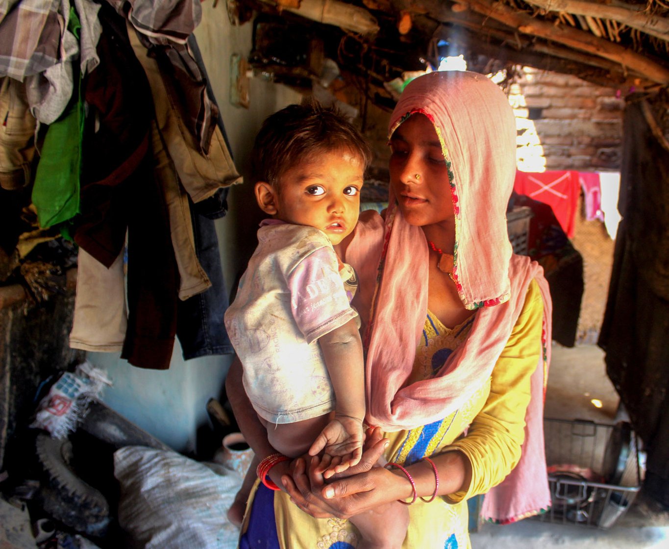 Nageena Khan's bangles broke and pierced the skin recently when her husband hit her. Left: With her younger son