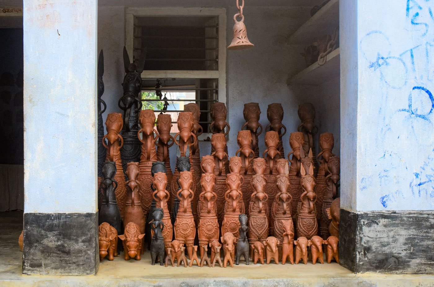 In the potter's colony in West Bengal's Panchmura village, local Adivasi communities were the only buyers during the lockdown for traditional votive horses (right)