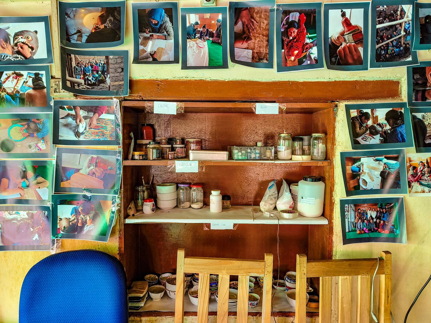 Right: A part of the workshop where raw materials for the paintings are stored. Also seen are photographs from HAP’s earlier exhibitions