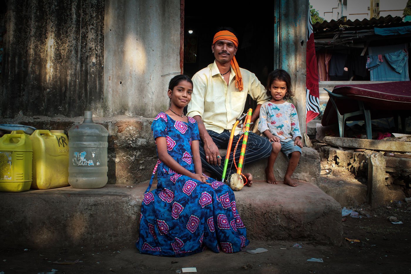 Right: Kishan sitting at home with Bharti and Yuvraj