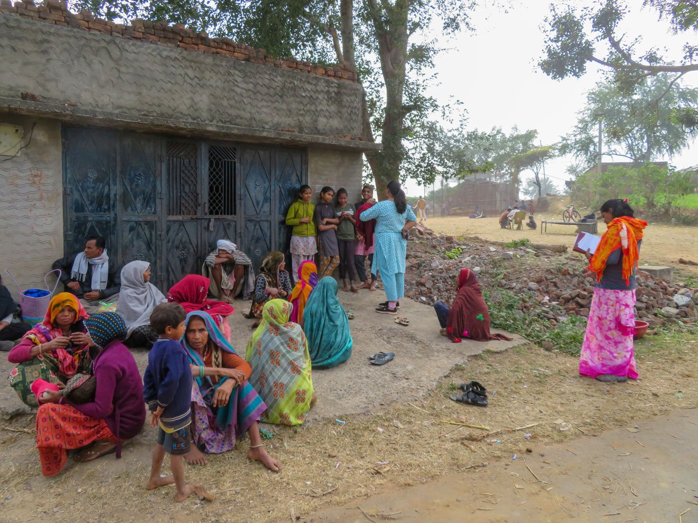 Right: Teena speaking to young girls