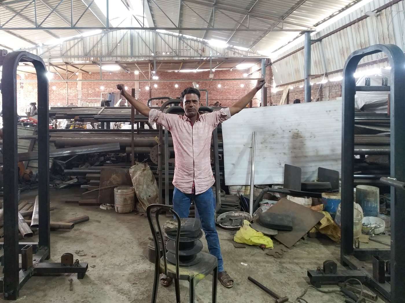 Left: Asif Saifi finalising the distance between two ends of the multi-gym based on the cable crossover exercise.