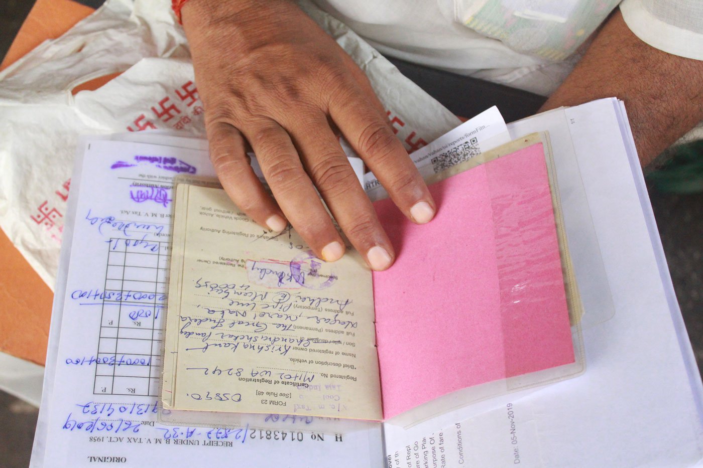 Left: Rakesh Mishra, vice-president, Bhartiya Taxi Chalak Sangh, says they understand that the auction was undertaken for security purposes, but its timing was wrong. Right: The papers and documents Krishnakant has put together to legally challenge the move: 'I don’t want to keep quiet but I am losing hope'