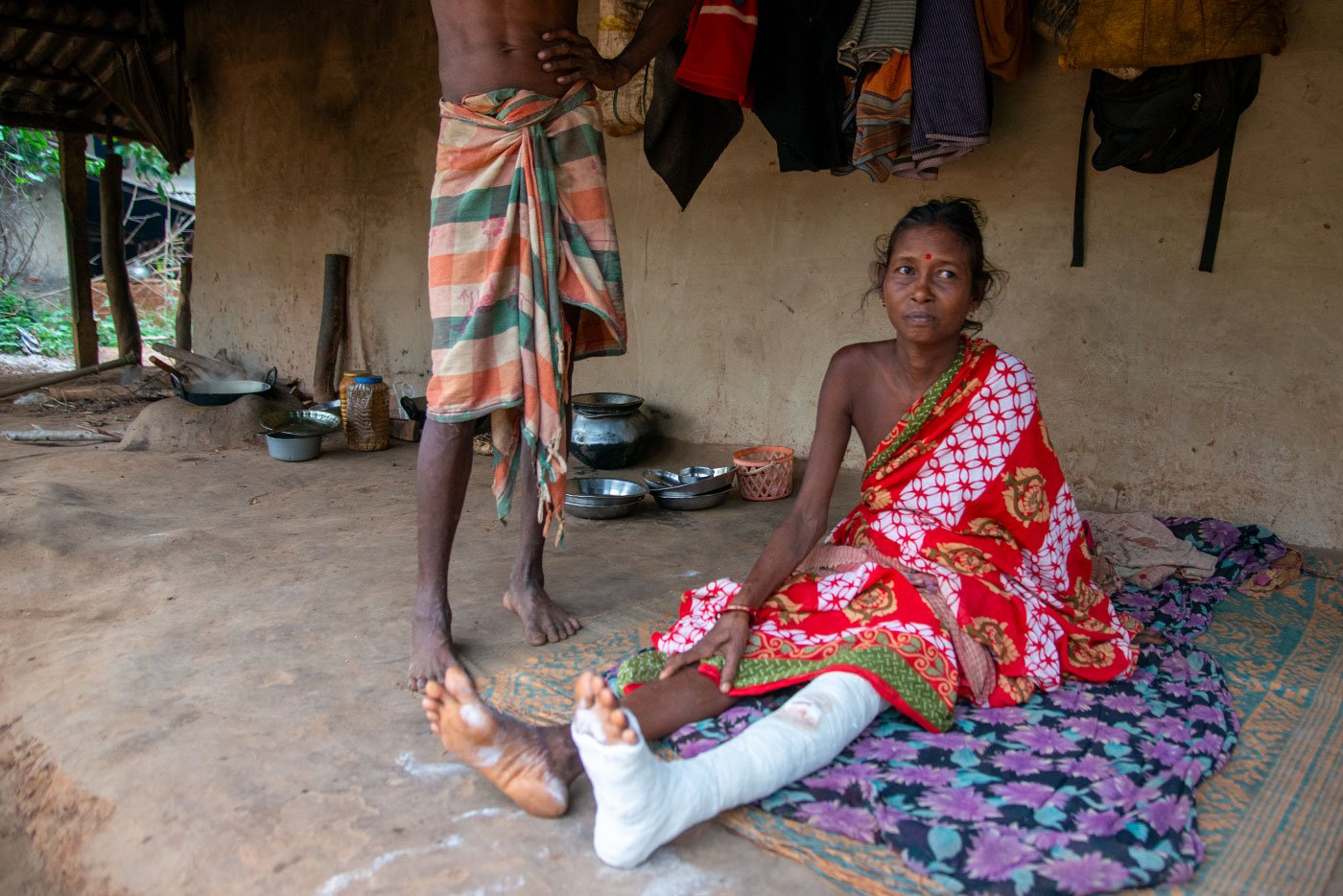 Kanak Kotal's hand (left) has become permanently deformed as she could not get medical help when she broke it. Her village, Singdhui, has little access to doctors and healthcare. Also true of Benashuli, where Kuni Bhakta (right) broke her leg, and now she is not sure when she will be able to walk again. Her husband Suben Bhakta says, they spent Rs. 8,000 on her treatment