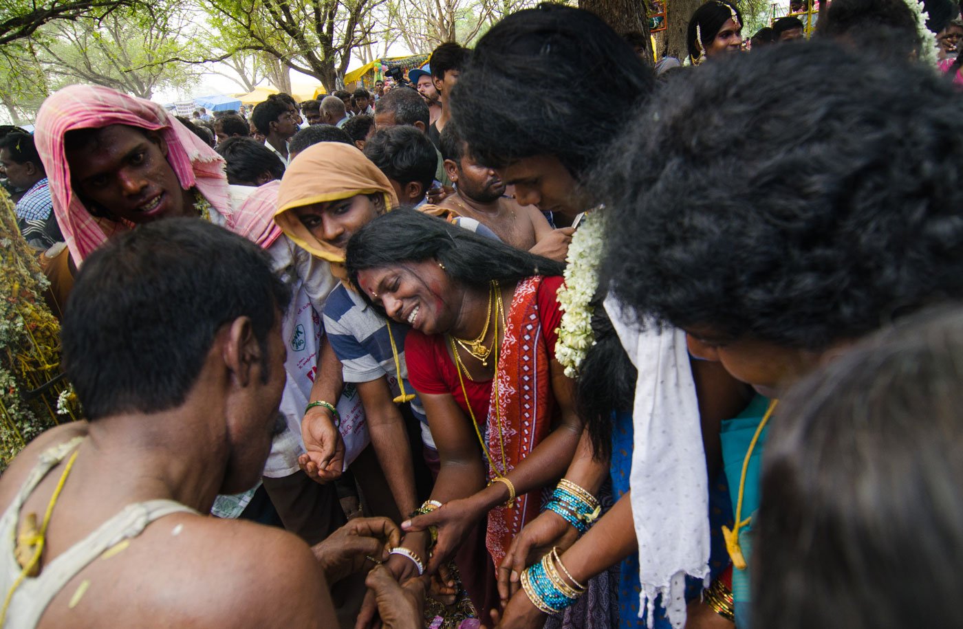 A priest breaks an aravani’s bangles – one of the rituals of widowhood. Visibly distraught, she begins to sob. Many visitors stand around watching the rituals