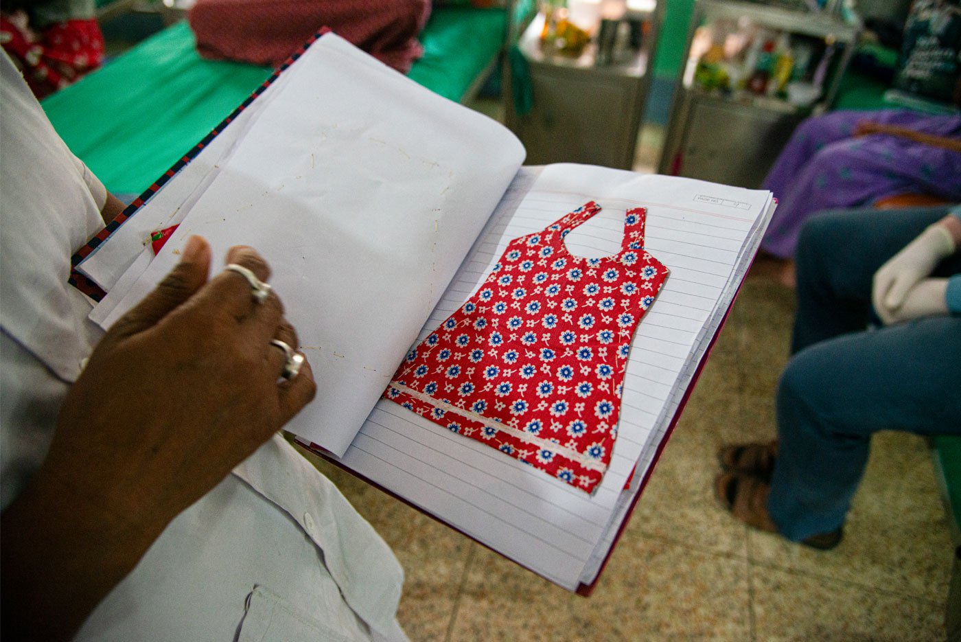 Right: A dress sample made by a 16-year-old bone TB patient at Bantra Society. Here patients are trained in needlework and embroidery to help them become self-sufficient