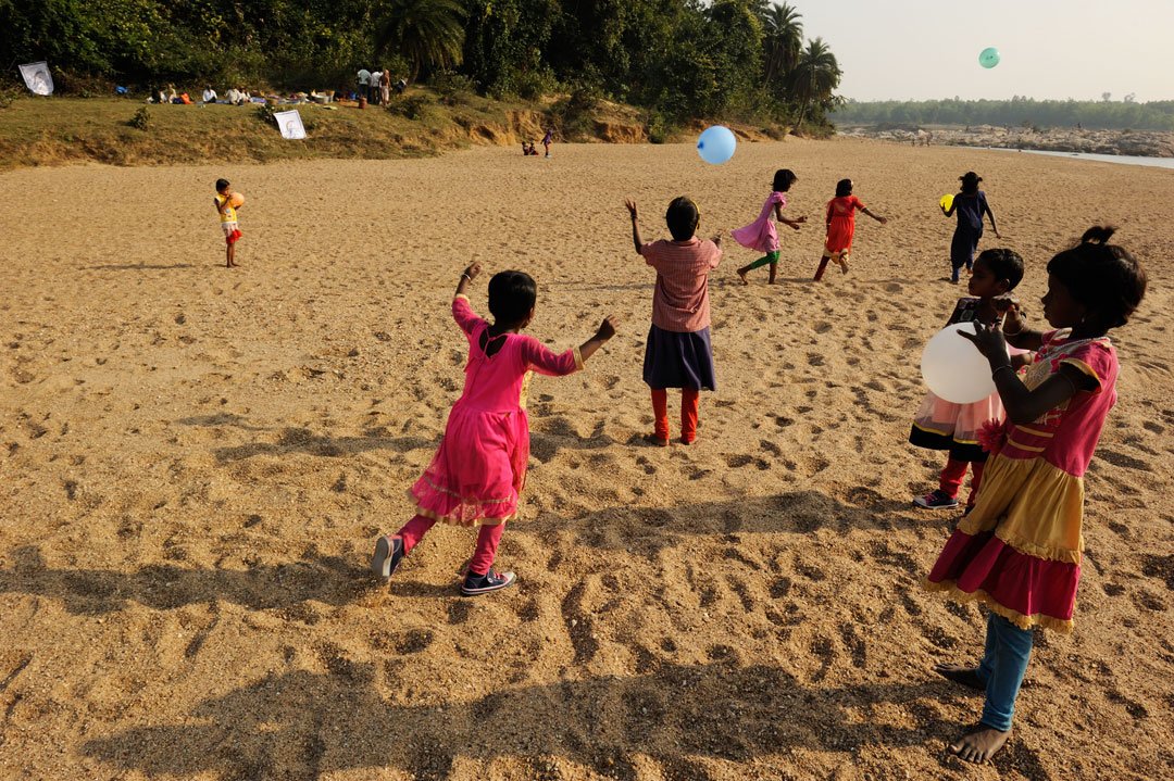 The students look forward to picnics on the sandbanks of the river in the village