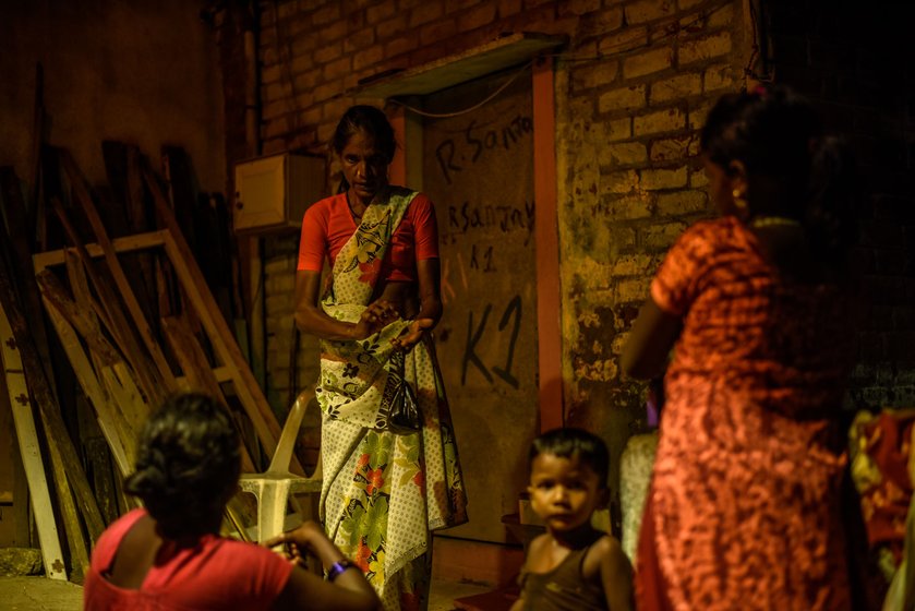 Left: Rita akka with her neighbours. Right: At home in the housing board quarters

