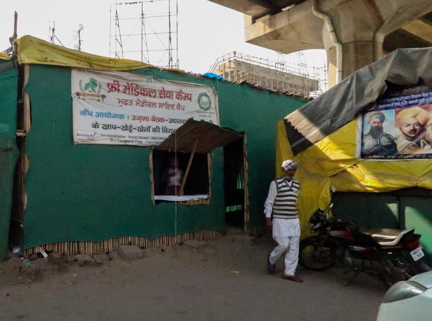 The free health clinic (left) that was set up for farmers camping at the Tikri border site. Dr. Sakshi Pannu (in the pink dress) ran it every day since April