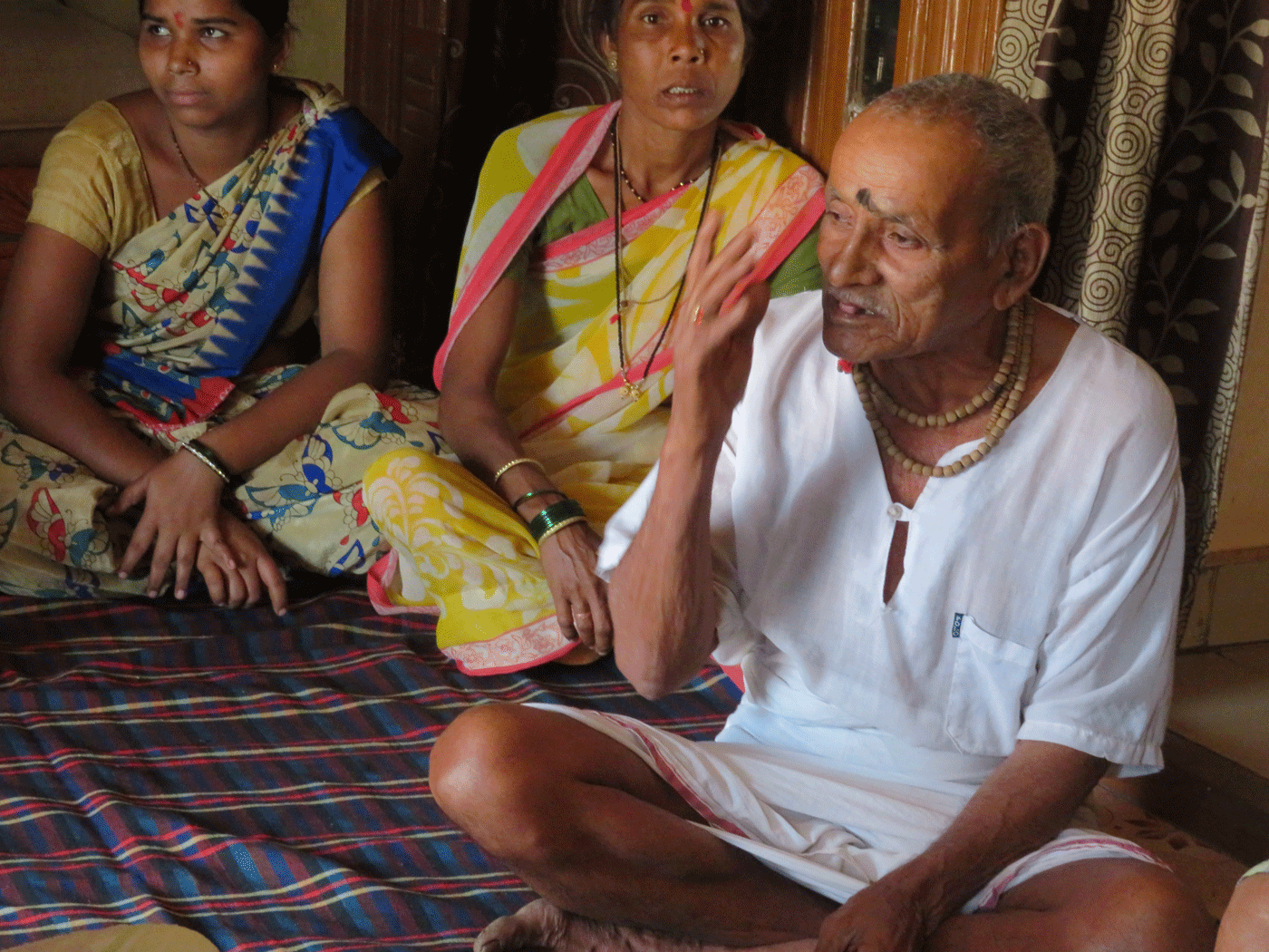 Villagers discussing upcoming elections