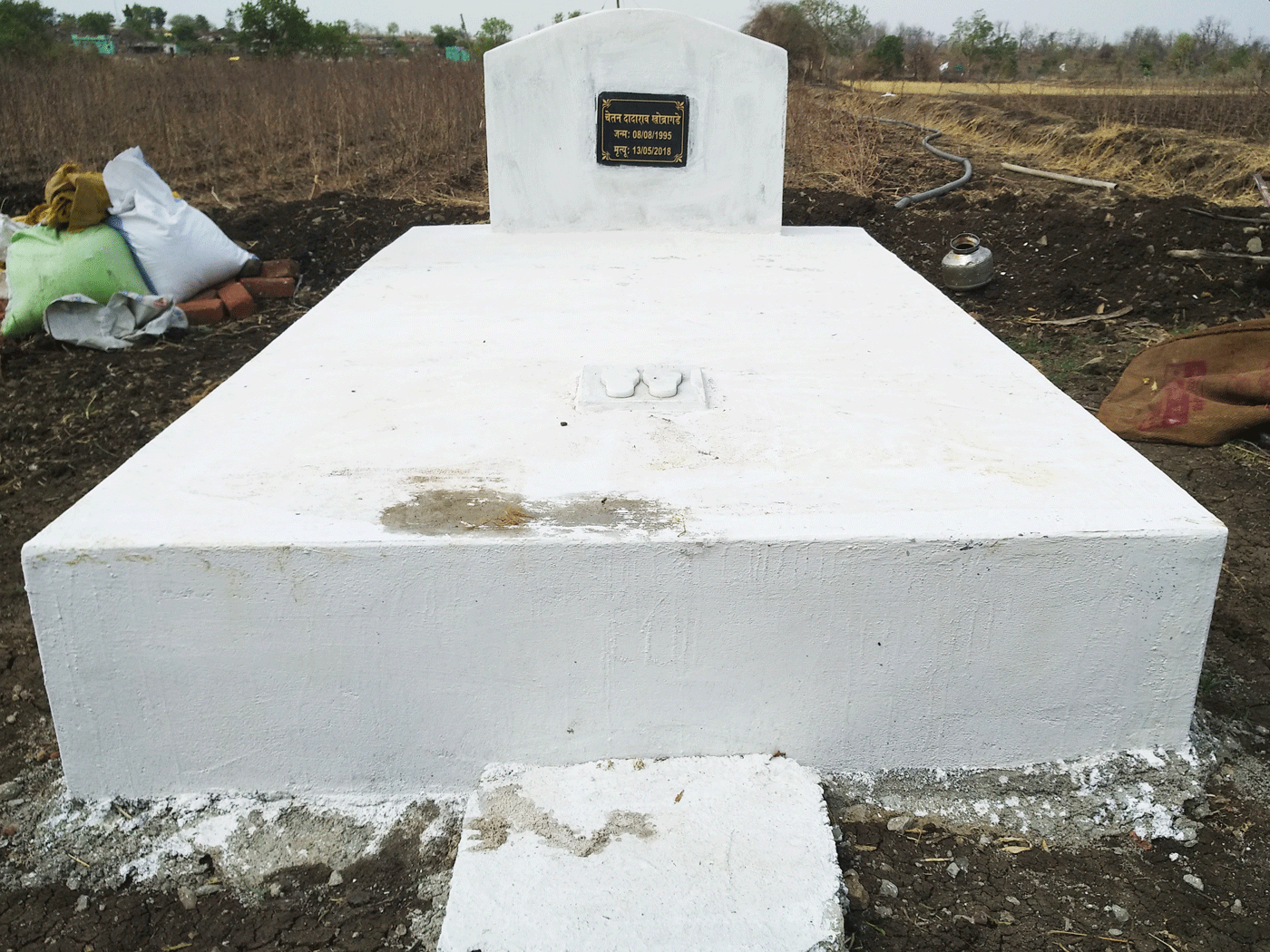The memorial to Chetan Khobragade in Amgaon. Right: Dadarao Khobragade stands where his son was mauled by a tiger on their farm in Wardha district
