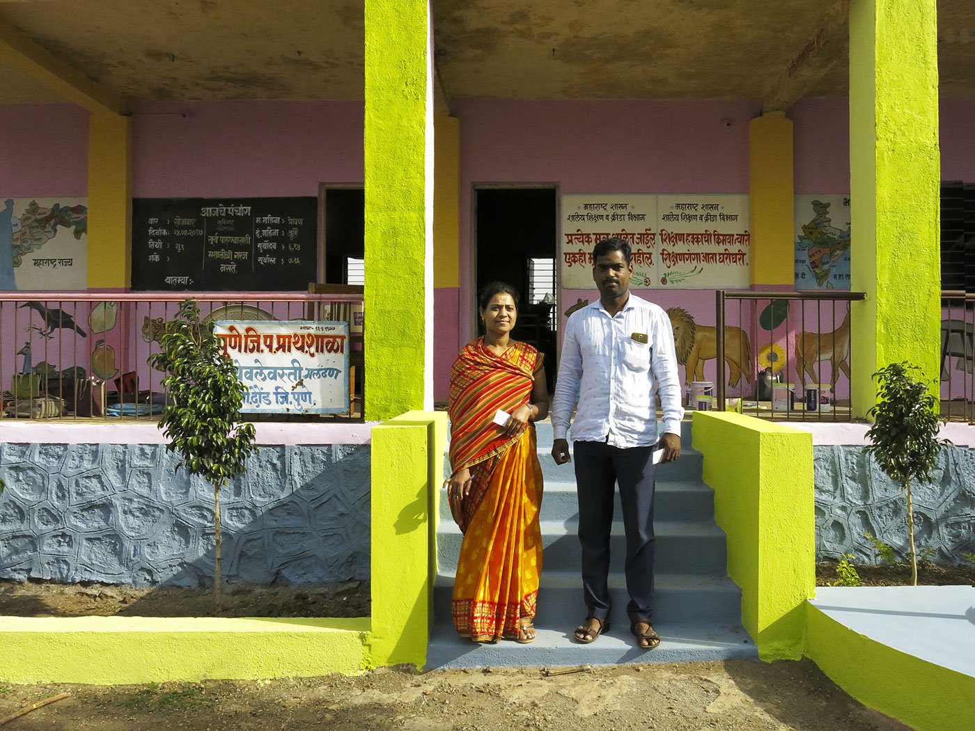 Teachers standing outside school
