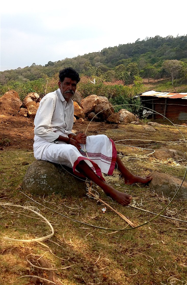 Kathi Kuttan making bamboo strips for a new temple in his Toda village