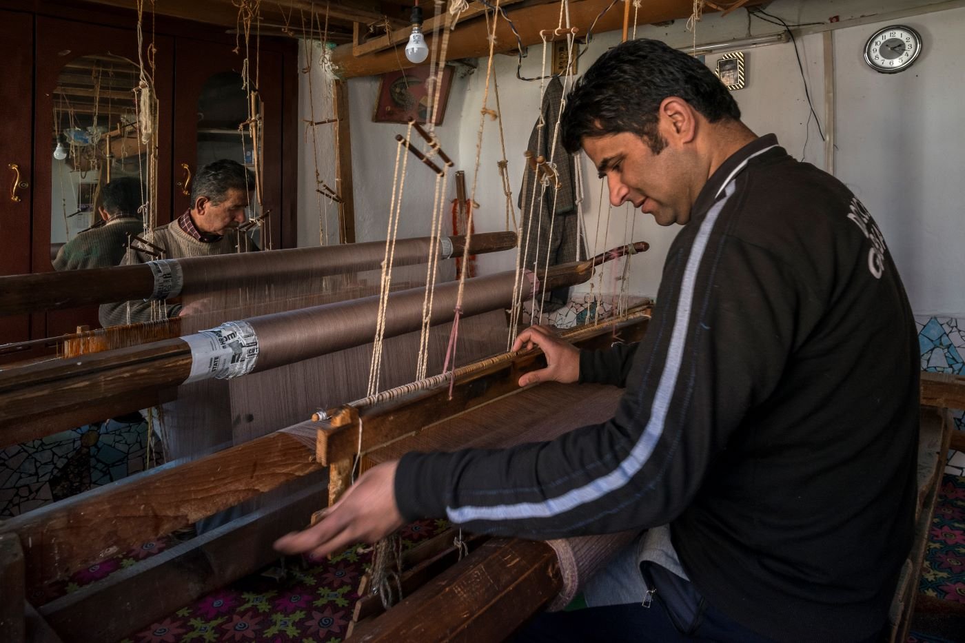 Mohammed Sidiq Kotha and his son Irshad Ahmed Kotha have been hand-weaving pashmina shawls on the charka for decades. They that the speed of machine-woven shawls is hard to compete with